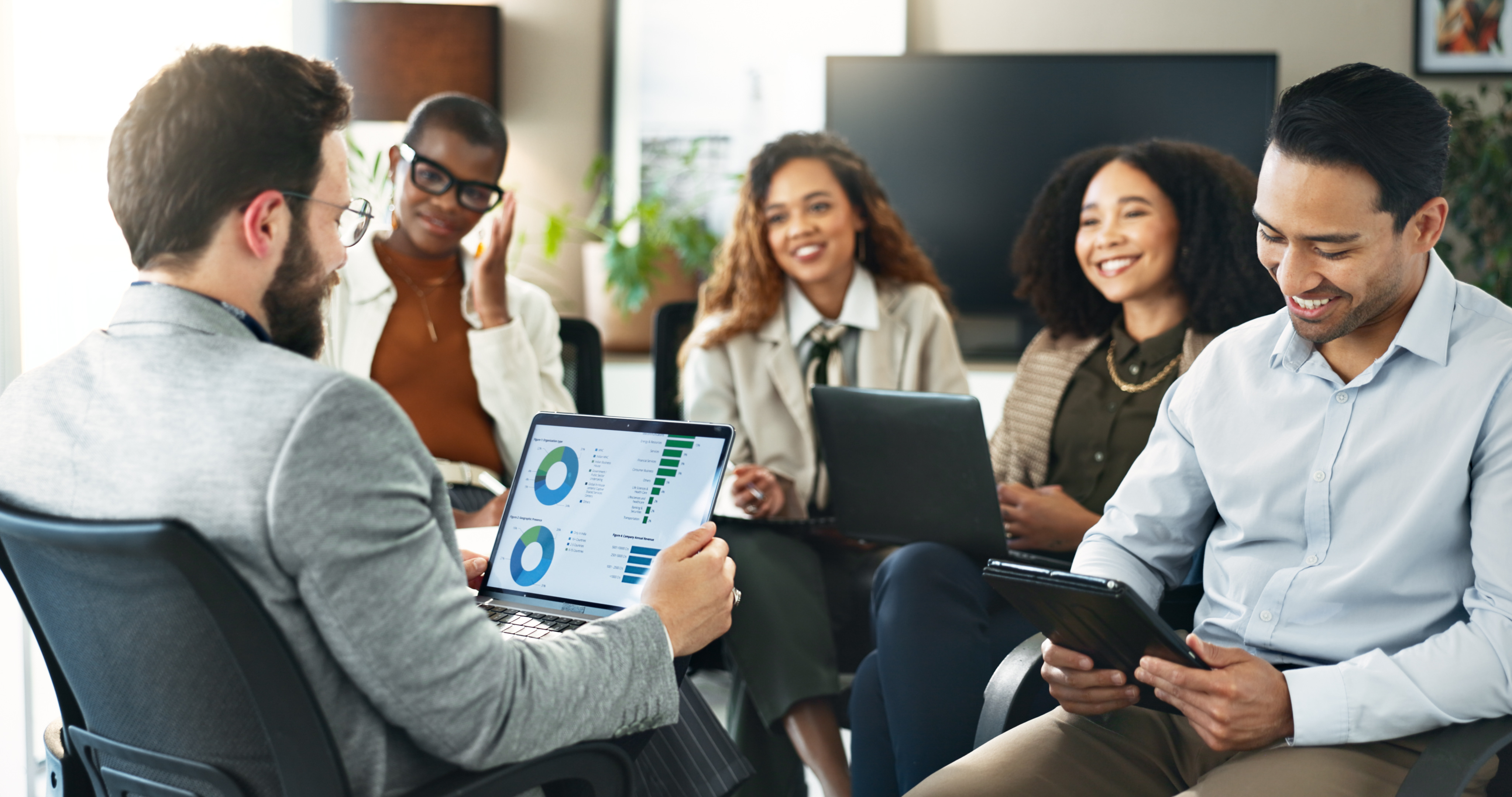 Diverse team reviewing data in a modern conference room